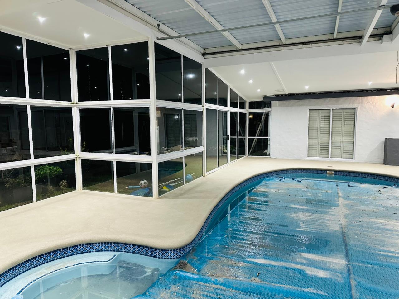 After photos of a pool pebble paving job in Cape Town