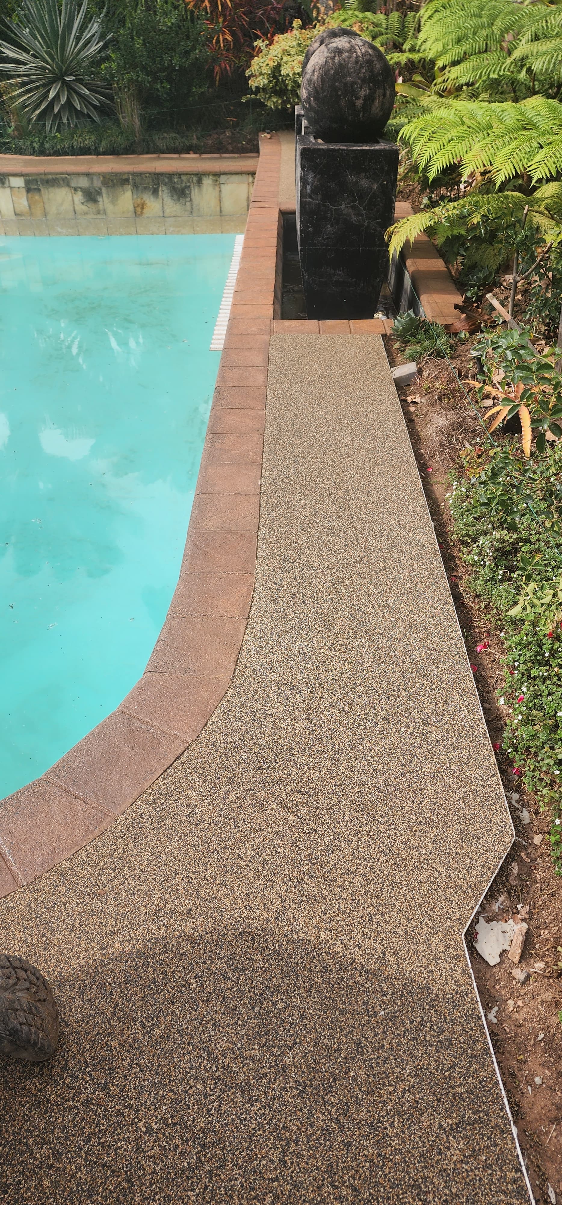 Pebbles around a pool